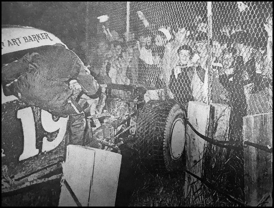 Art Barker climbs from his racer after crashing into the fence. Courtesy of Bruce Bonham