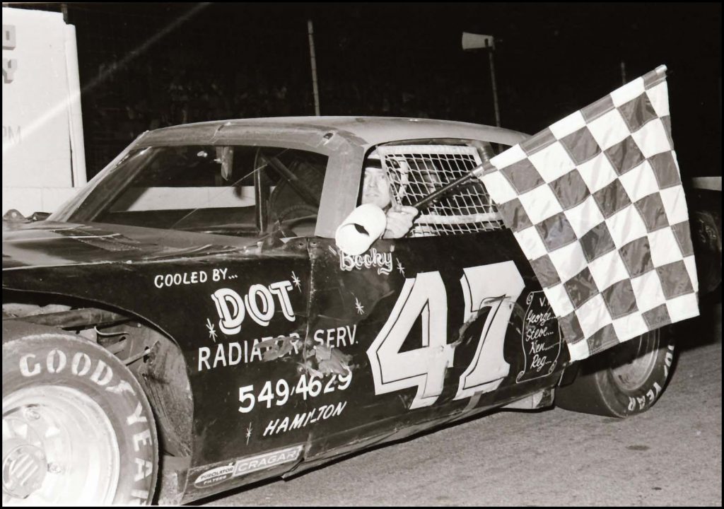Ralph Book takes the Checkers at Flamboro Speedway Courtesy of Brian Norton (Photo By Tex)