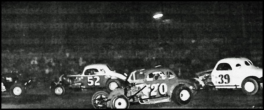 Terry Edwards #20 gets crossed up as Jeno Begolo #16, Stan Frieson #52, and Don Turner #39 power on by in the Sportsman Division at Merritteville Speedway. Photo by Bruce Bonham