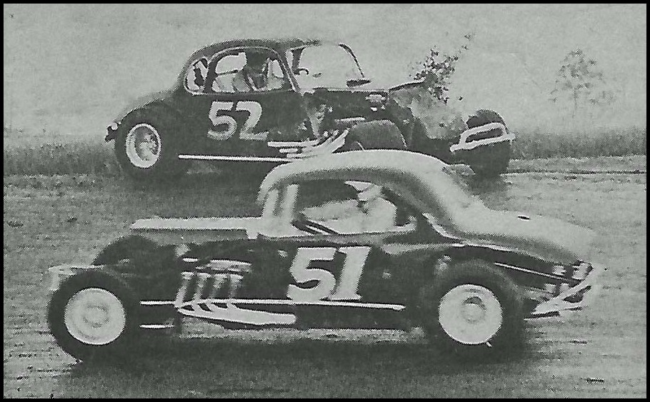 Terry Edwards # 51 slips under his team car driven by Bill Rafter in Modified action at Merrittville. Courtesy of Wheelspin News.