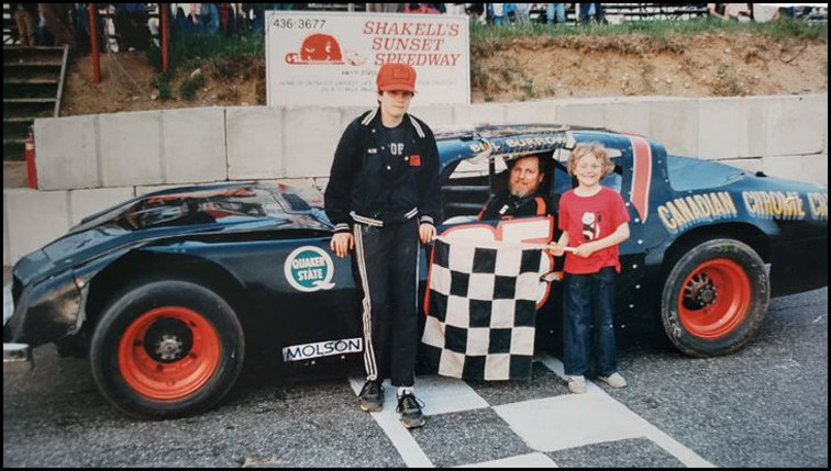 Bill Burrows takes the Checkers at Sunset Speedway.